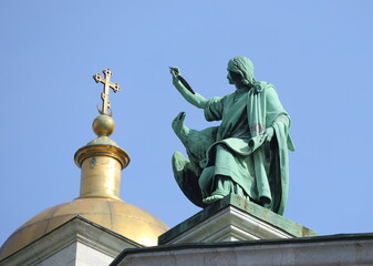 Fototapeta na wymiar Statue of John with an eagle on the roof of St. Isaac's Cathedral, St. Petersburg, Russia, April 2023
