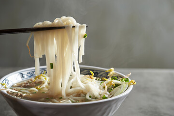 Rice noodle noodles holding with chopsticks