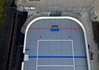 field hockey or ice hockey field. plastic grids of the dportovist surface under which there are...