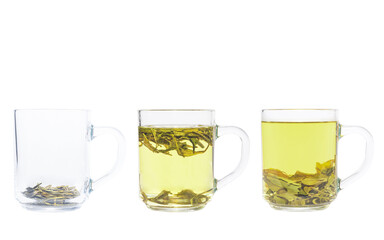 Tea brewing process. Three transparent cups of green tea. Dragon Well green tea (Longjing tea). On a white background.