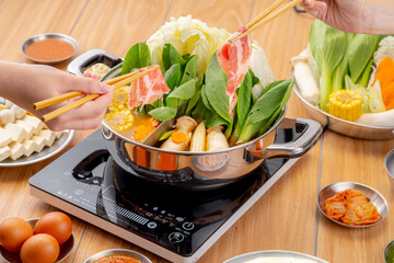 enjoy eating Shabu Shabu and Sukiyaki in a hot pot at Japanese 
restaurant