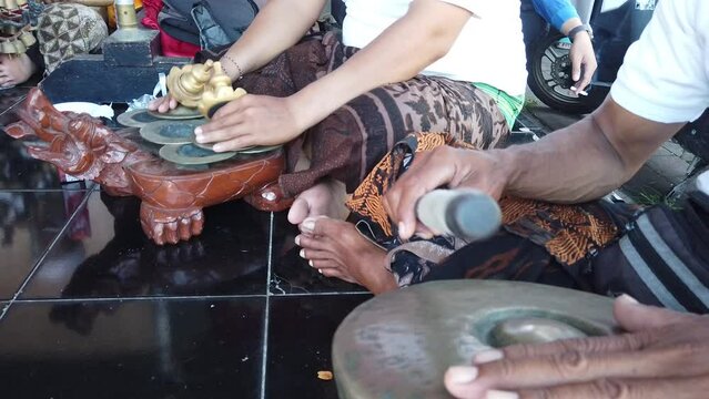 Gamelan Musicians from Bali Play Percussion Musical Instruments in Temple Ceremony, Asian Cultural Art