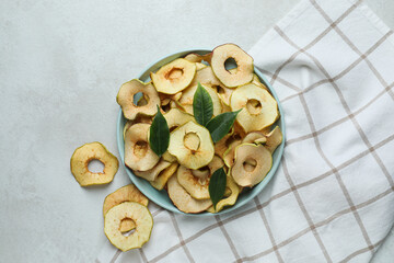 Concept of tasty food, dried apple chips, top view