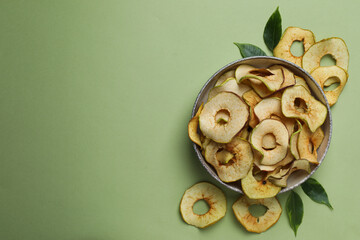 Concept of tasty food, dried apple chips, space for text