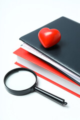 Medical literature - books and doctors accessories on white background