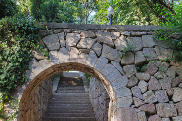Fototapeta na wymiar Masonry Archway and Staircase inside Montjuic Garden Public Park, Barcelona, Spain