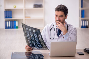 Young male doctor radiologist working in the clinic