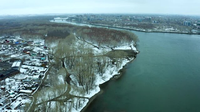 bird's-eye view of mountains, river and city winter day, panoramic view of mountains near the river, Ust Kamenogorsk, Kazakhstan.