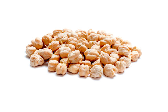 Heap of dry chickpeas isolated on white background close-up.