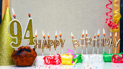 Happy birthday background with golden candles and decorations with candles burning number  94....
