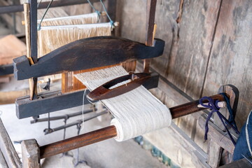 Ancient hand-weaving wooden loom, close-up photo, Hmong village. Vietnam