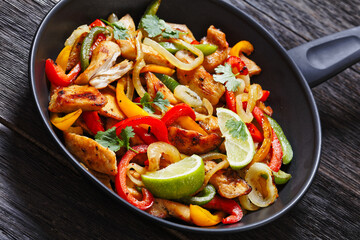 chicken fajitas with bell peppers, onion, spices