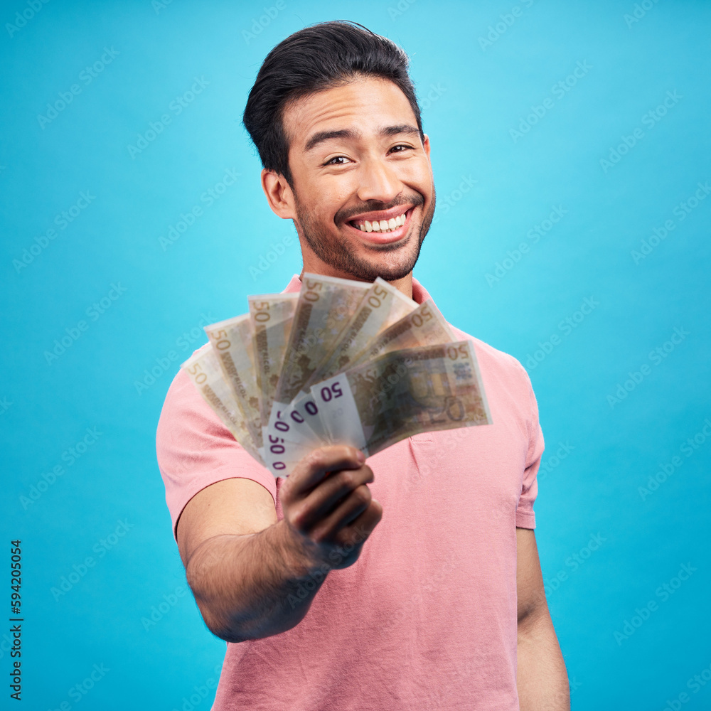 Wall mural Man in portrait, money fan with financial freedom and cash, prize or reward isolated on blue background. Finance with savings, bonus and payment, happy male person with economic success in studio