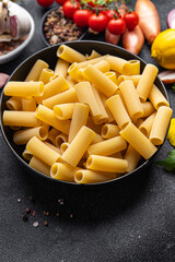 raw pasta rigatoni ingredient meal food snack on the table copy space food background rustic top view