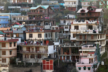 Fototapeta na wymiar houses on the river Manali is a town, near Kullu town in Kullu district in the Indian state of Himachal Pradesh