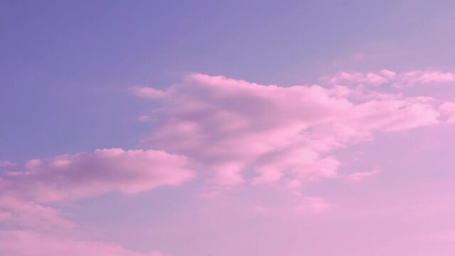 Amazing Pink Clouds in a Marshmallow Pink Lilac Sky at Sunset. Time Lapse of Colorful Clouds in A Sunset Skyscraper, Beautiful View, 4K Background, Beauty, Relax. Colored Firmament.