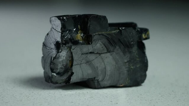 4k 30p Russian Elite Shungite Crystal Stone. Macro nature crystal gemstone high-quality product shots.