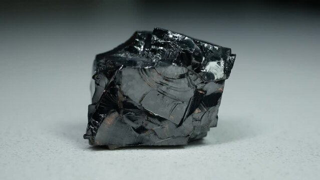 4k 30p Russian Elite Shungite Crystal Stone. Macro nature crystal gemstone high-quality product shots.