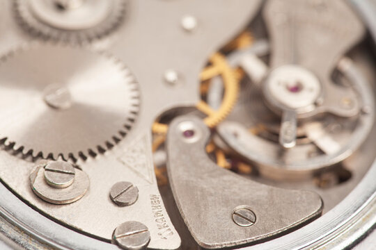 Mechanism, clockwork of a watch close-up. Vintage luxury background. Time, work concept