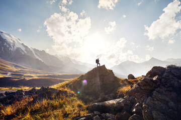 Hiker with big backpack in the mountains