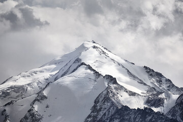 Landscape of snowy mountain summit