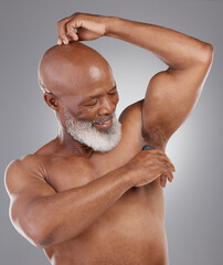 Senior black man, deodorant and armpit for skincare, grooming or person hygiene against a gray...