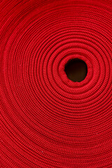 Fototapeta na wymiar bobine di tessuto di colore rosso 