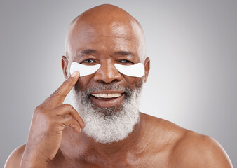 Collagen eye mask, skincare or portrait of black man and smile, happiness or face treatment on...