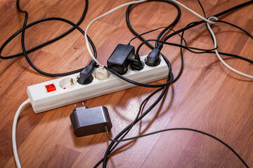 Concept of increasing power consumption and growing electricity demand, electric splitter with lots...