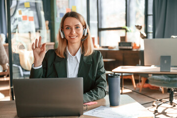 Fototapeta premium Portrait of young beautiful woman in formal clothes that is working in the office