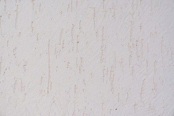 The surface of the wall with the texture of decorative plaster. 