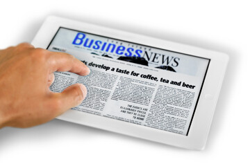 Man with  digital tablet and business news on on background