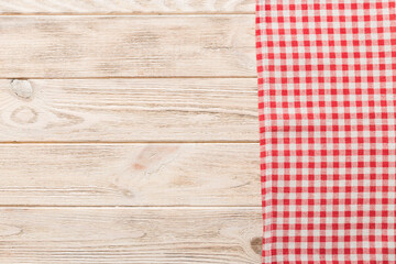 top view with red empty kitchen napkin isolated on table background. Folded cloth for mockup with copy space, Flat lay. Minimal style