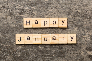 Happy january word written on wood block. Happy january text on table, concept