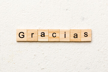 gracias word written on wood block. gracias text on table, concept
