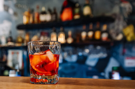Cocktail Negroni with gin, campari martini rosso and orange. negroni cocktail at the bar