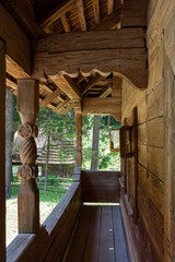 Terrace in an old wooden house, historical traditional architecture of Ukraine. Summer sunny day