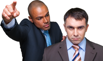 One businessman pointing and looking sternly at another businessman