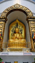 Fototapeta premium Statue of Buddha at the World Peace Pagoda in Pokhara, Nepal. Also known as Shanti Stupa and built by Japanese Buddhists, it is meant to be a symbol to unite humanity in a desire for peace. 