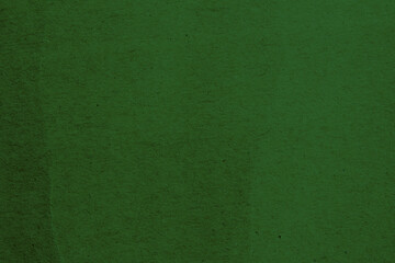 Green paper texture background. Abstract dark green surface for designs.