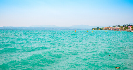 Naklejka na ściany i meble Famous Sirmione at lake Garda, Italy, on a sunny day in springtime. 