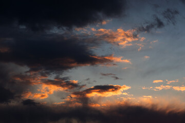 Sunset sky with orange clouds. Nature background.