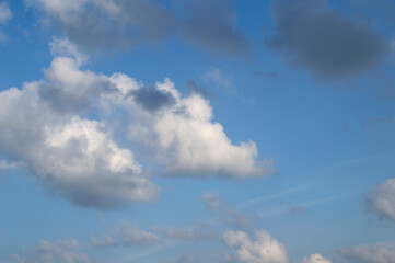 white fluffy clouds in the blue sky