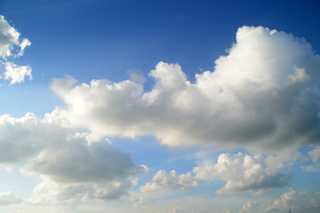 white fluffy clouds in the blue sky