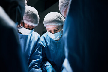 Hospital, surgery and team of doctors in theatre for medical support, teamwork or healthcare...