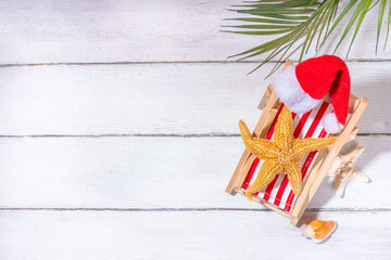 Christmas in July summer holiday or sale background. Summer vacation accessories, seashells,...
