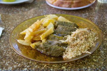 grape leaves  rolls served with cous cous and potatoes