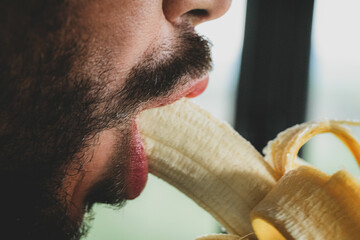 man eating banana