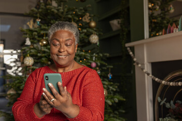 Grandmother on a video call with family at Christmas time
