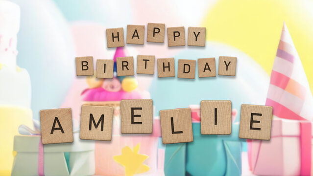 Happy Birthday Amelie card with wooden tiles text. Girls birthday card with colorful background.